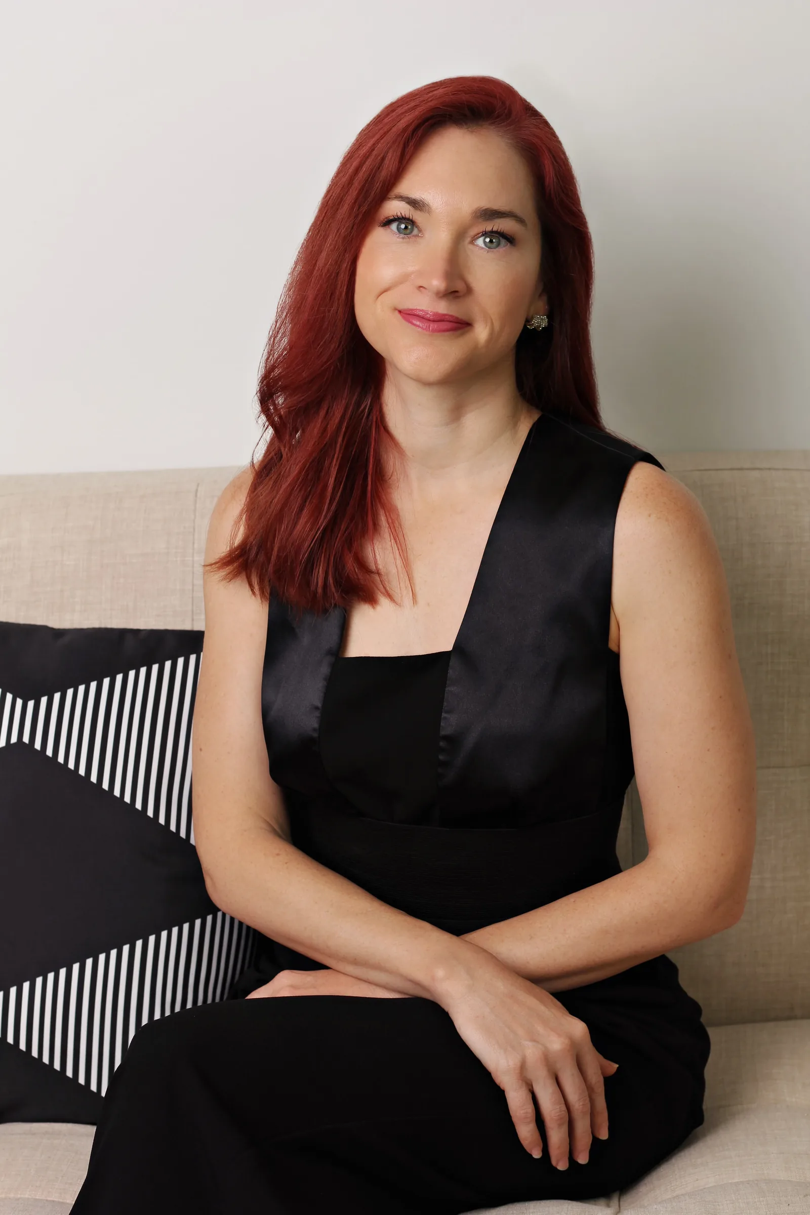 Professional headshot of Sarah in an office